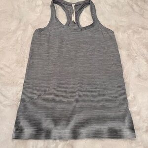 Lululemon tank. Women’s size 6. Color is a grey and black stripe.